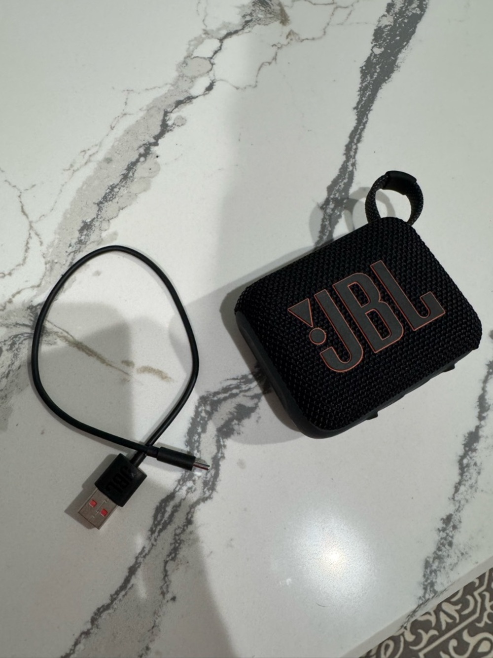 JBL Black Portable Bluetooth Speaker with Copper Logo Accent